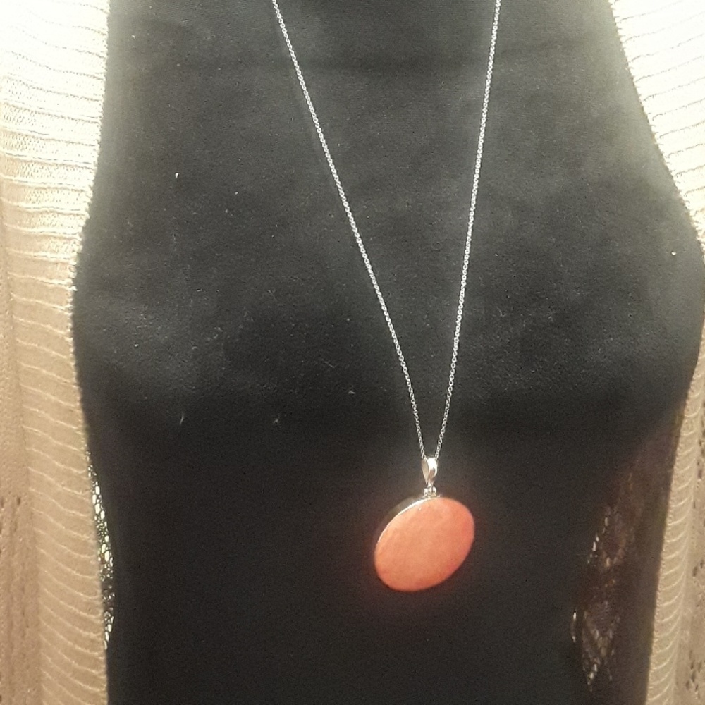 Reddish orange stone pendant